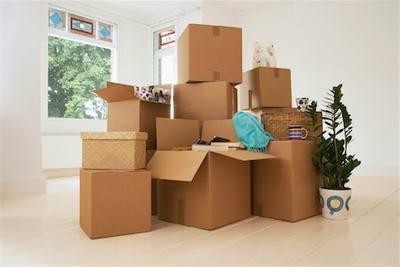 Stack of Boxes in New House Stock Photo - Premium Royalty-Free, Code: 693-03302691