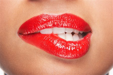 Woman biting lip Stock Photo - Premium Royalty-Free, Code: 693-03302800