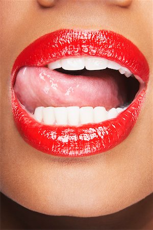 Woman Licking Red Lips Stock Photo - Premium Royalty-Free, Code: 693-03302801