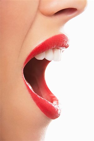 Woman's open red lips, yelling Stock Photo - Premium Royalty-Free, Code: 693-03302848