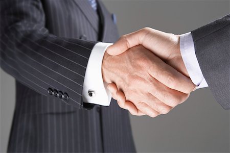 Businessmen Shaking Hands, close-up on hands Stock Photo - Premium Royalty-Free, Code: 693-03302890