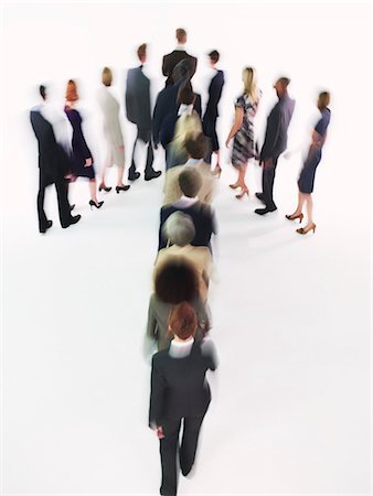 Group of Businesspeople walking in arrow formation Stock Photo - Premium Royalty-Free, Code: 693-03302905