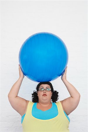 simsearch:693-03557462,k - Overweight Woman Holding Exercise Ball on head Stock Photo - Premium Royalty-Free, Code: 693-03302941