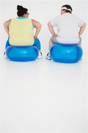 simsearch:693-03557462,k - Overweight man and woman Resting on Exercise Balls, back view Stock Photo - Premium Royalty-Free, Code: 693-03302950
