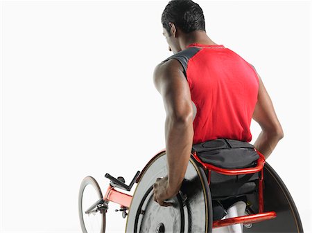 paraolimpionici - Paraplegic cycler, back view Fotografie stock - Premium Royalty-Free, Codice: 693-03302969