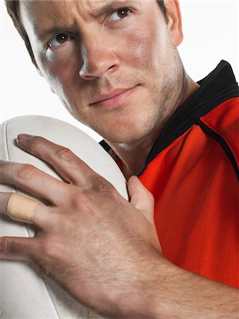 simsearch:693-03565397,k - Rugby player holding ball, close-up, portrait Stock Photo - Premium Royalty-Free, Code: 693-03302999