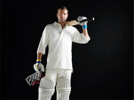 simsearch:693-03565397,k - Cricket player, standing holding cricket bat on shoulder Stock Photo - Premium Royalty-Free, Code: 693-03302990