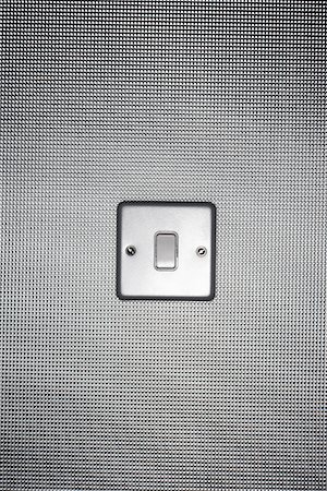 Silver light switch on wallpaper covered wall Foto de stock - Sin royalties Premium, Código: 693-03303048