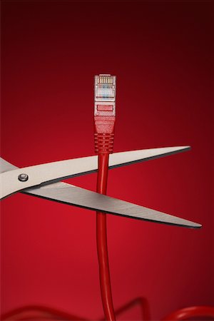 red data - Scissors Cutting Data Cable Plug Stock Photo - Premium Royalty-Free, Code: 693-03303091
