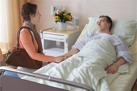 Woman Visiting Husband in Hospital Stock Photo - Premium Royalty-Free, Code: 693-03303153