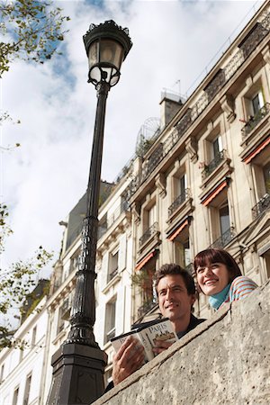 paris streetlight - Couple Sightseeing Stock Photo - Premium Royalty-Free, Code: 693-03303395