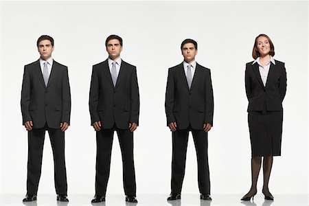 Businesspeople standing side by side, arms by side, behind back Stock Photo - Premium Royalty-Free, Code: 693-03303662