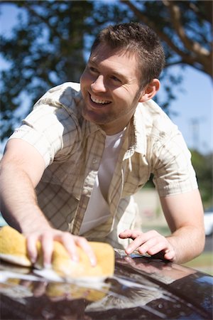 Man washing car Stock Photo - Premium Royalty-Free, Code: 693-03314059