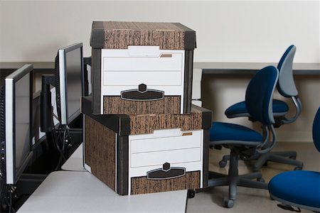 Moving Boxes on Office Desk Stock Photo - Premium Royalty-Free, Code: 693-03314140