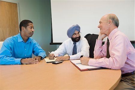 simsearch:693-03314173,k - Multi Racial Group of Business People in a Meeting Stock Photo - Premium Royalty-Free, Code: 693-03314175