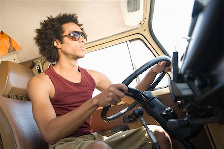 Young man in camper van Stock Photo - Premium Royalty-Free, Code: 693-03314305