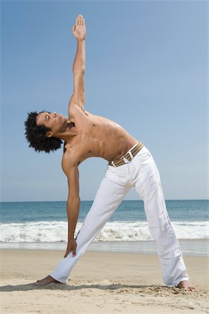 Young man exercising on beach Stock Photo - Premium Royalty-Free, Code: 693-03314310