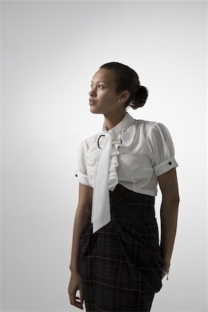 Young elegant woman, studio shot Foto de stock - Sin royalties Premium, Código: 693-03315079