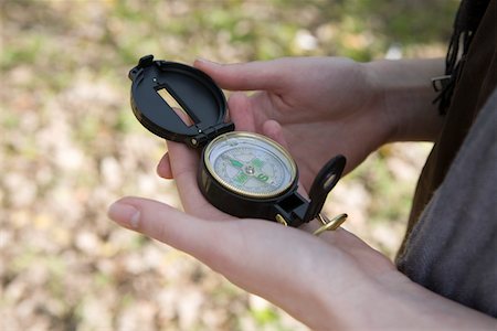 Close-up of womans hands with compass Stock Photo - Premium Royalty-Free, Code: 693-03315115