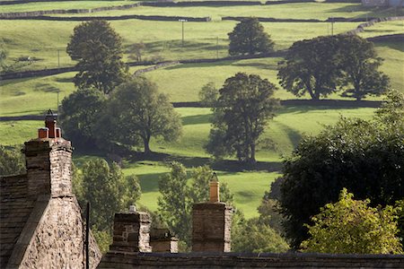 simsearch:693-03315199,k - Roofs of houses and trees on fields in Yorkshire Dales, Yorkshire, England Stock Photo - Premium Royalty-Free, Code: 693-03315209