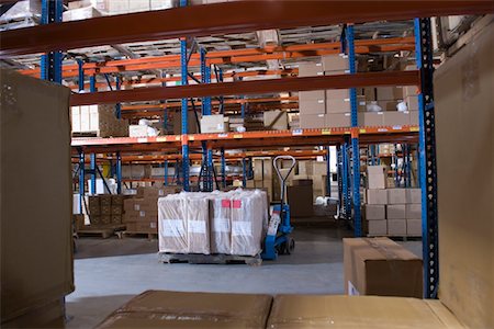 distribution - Cardboard boxes on shelves in distribution warehouse Stock Photo - Premium Royalty-Free, Code: 693-03315353