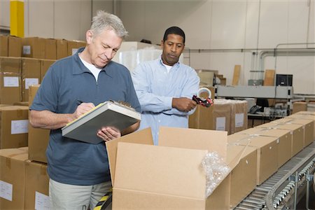distribution warehouse - Men inspecting goods in distribution warehouse Stock Photo - Premium Royalty-Free, Code: 693-03315369