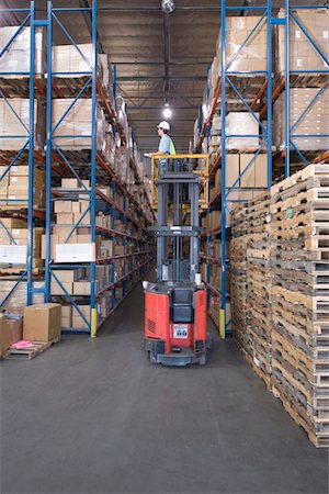 distribution warehouse - Cardboard boxes and wooden pallets in distribution warehouse Stock Photo - Premium Royalty-Free, Code: 693-03315361