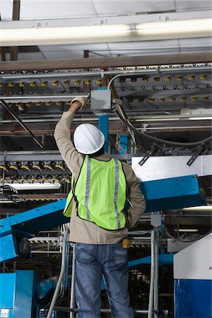 press manufacture - Man working in factory Stock Photo - Premium Royalty-Free, Code: 693-03315420