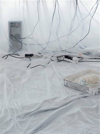plug mess - Computer and cables covered in dust sheets with paint roller in foreground Stock Photo - Premium Royalty-Free, Code: 693-03315659