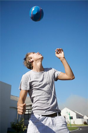 South Africa, Cape Town, teenage boy playing ball Stock Photo - Premium Royalty-Free, Code: 693-03316556