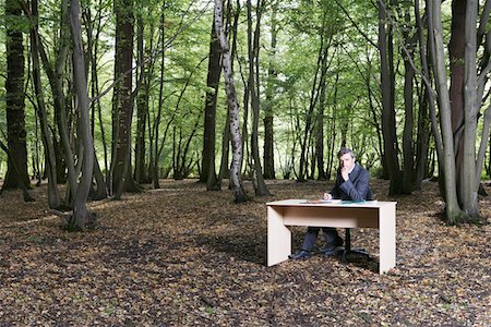 forest clearing - Business man sitting at desk in middle of forest Stock Photo - Premium Royalty-Free, Code: 693-03310007