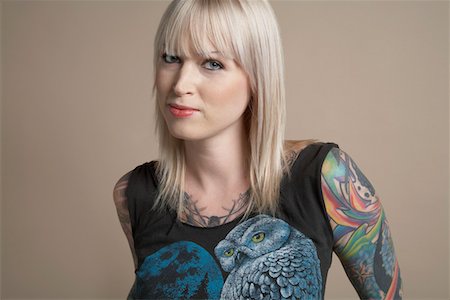 Young tattooed woman, portrait Stock Photo - Premium Royalty-Free, Code: 693-03310906