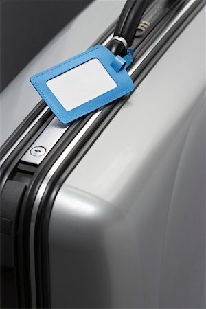 Suitcase with blank tag, close-up Foto de stock - Sin royalties Premium, Código: 693-03311134