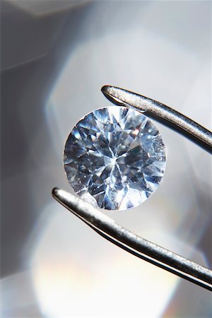 diamond - Diamond held by tweezers, close-up Stock Photo - Premium Royalty-Free, Code: 693-03311170