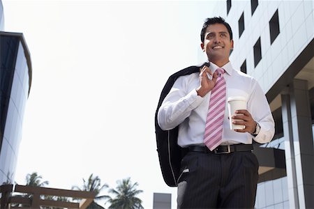 simsearch:693-03311509,k - Business man wearing hard hat on city rooftop Stock Photo - Premium Royalty-Free, Code: 693-03311532