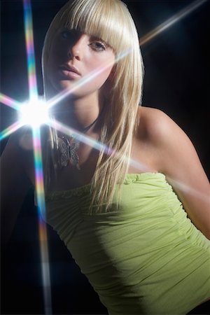 disco party - Young woman dancing in disco Stock Photo - Premium Royalty-Free, Code: 693-03312009