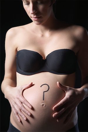 simsearch:693-03315753,k - Pregnant woman with question mark on abdomen, studio shot Stock Photo - Premium Royalty-Free, Code: 693-03312029