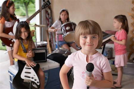 playing guitar and drums - Group of girls (7-9) with instruments in garage Stock Photo - Premium Royalty-Free, Code: 693-03312052