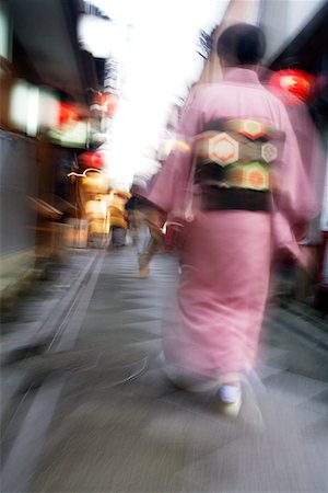 simsearch:693-03312841,k - Japan, Kyoto, Pontocho-dori, Woman wearing kimono walking on narrow street, motion blur Fotografie stock - Premium Royalty-Free, Codice: 693-03312606