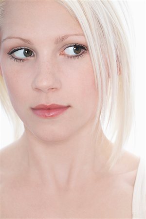 Studio shot of young woman, close-up Foto de stock - Sin royalties Premium, Código: 693-03312619