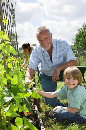 Boy gardening with grandfather, portrait Stock Photo - Premium Royalty-Free, Code: 693-03312900