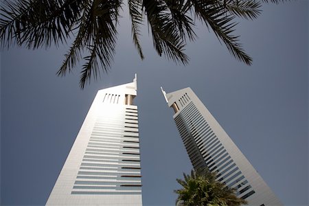 emirates towers office building - Dubai, UAE, View of Emirates Towers on Sheikh Zayed Road in Dubai Stock Photo - Premium Royalty-Free, Code: 693-03313723