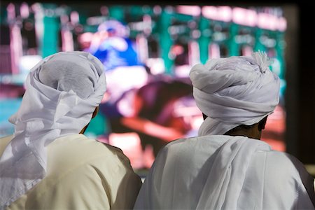 Dubai, UAE, Two men traditionally dressed in dishdashs and gutras Stock Photo - Premium Royalty-Free, Code: 693-03313740