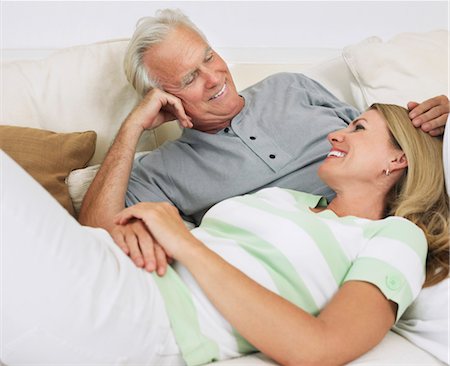 Couple lying on bed Stock Photo - Premium Royalty-Free, Code: 693-03363686