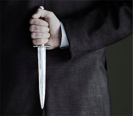 Man Holding Knife Stock Photo - Premium Royalty-Free, Code: 693-03363711