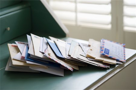 Letters on writing desk Stock Photo - Premium Royalty-Free, Code: 693-03440859