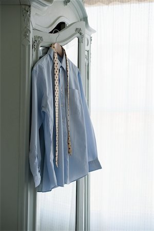 shirt on hanger - Shirt and tie hang on wardrobe Stock Photo - Premium Royalty-Free, Code: 693-03440870