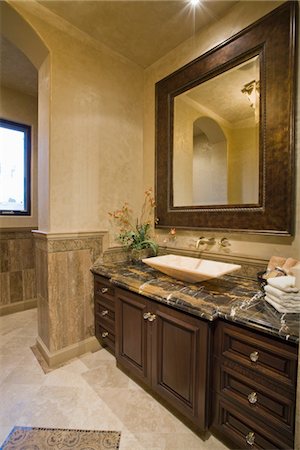 Dark brown bathroom unit with leather mirror frame Stock Photo - Premium Royalty-Free, Code: 693-03474076
