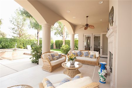 simsearch:693-03474115,k - Neutral outdoor room with cane furniture Foto de stock - Sin royalties Premium, Código: 693-03474140