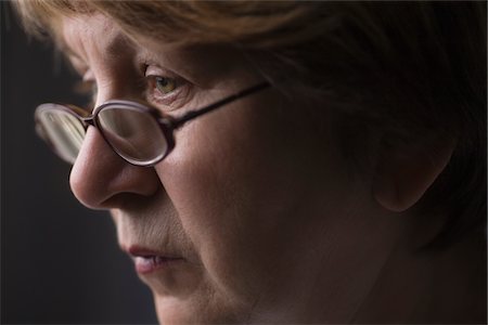 sad woman with short hair - Mature woman with reading glasses Stock Photo - Premium Royalty-Free, Code: 693-03474350